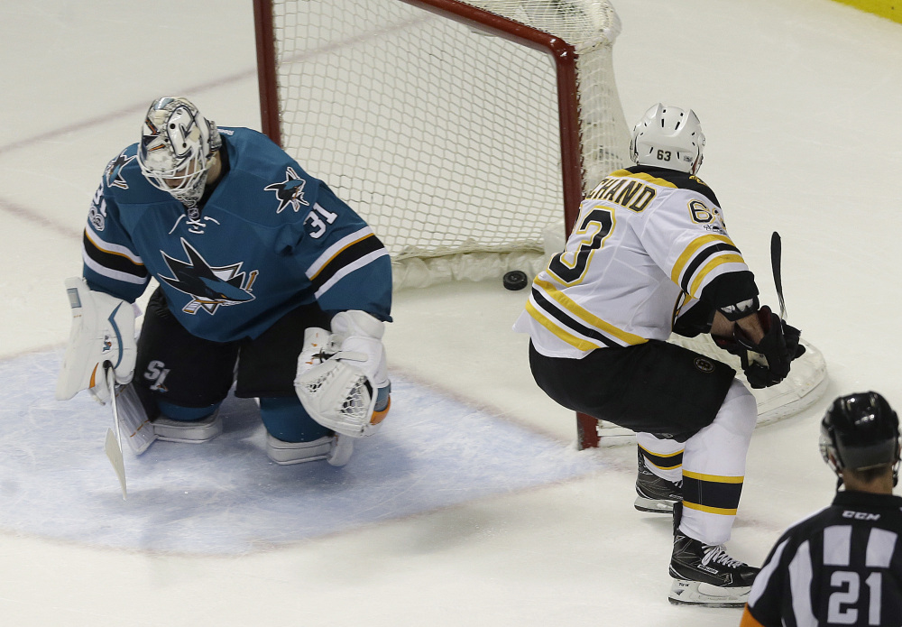 Boston left wing Brad Marchand, right, scores the winning goal on San Jose Sharks goalie Martin Jones during overtime of a game earlier this season in San Jose, California. The 5-foot-9, 181-pound forward, who was suspended for the last two games for spearing, will lead the Bruins in their opening-round series tonight at Ottawa.