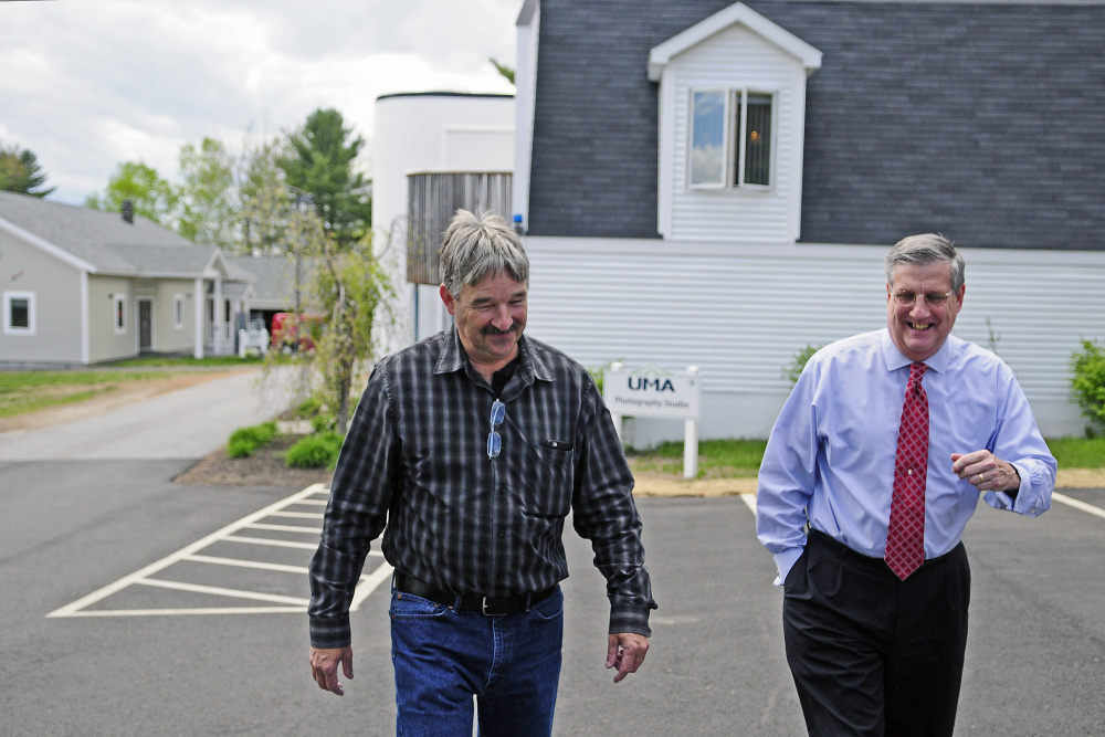 University of Maine at Augusta President James Conneely, on right, who is resigning at the end of the school year, tours buildings on May 19, 2016 at the University of Maine at Augusta. At left is Facility Director Peter St. Michel.