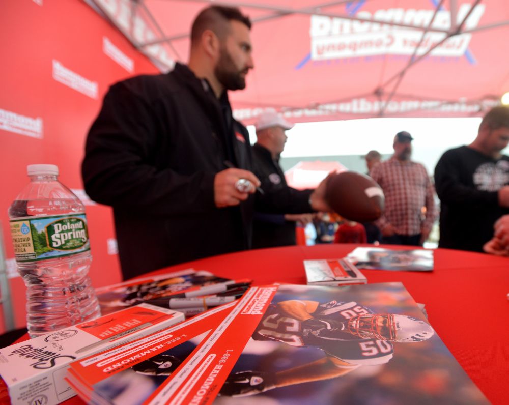Rob Ninkovich, of the New England Patriots, signs autographs Wednesday at Hammond Lumber Co. in Belgrade during a meet and greet with fans.