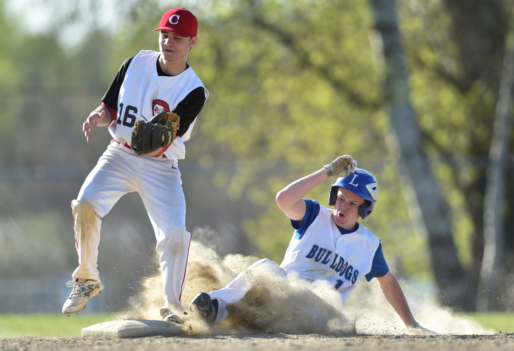 Lawrence baserunner Devon Webb slides safely into second base ahead of the throw to Cony's Kolbe Merfeld during a Kennebec Valley Athletic Conference Class A game last season in Fairfield.