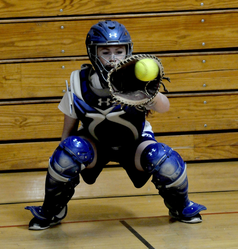 Madison junior Ashley Emery gets some work in behind the plate earlier this spring. Emery is moving from second base to the high-profile catching position for the reigning Class C state champions.