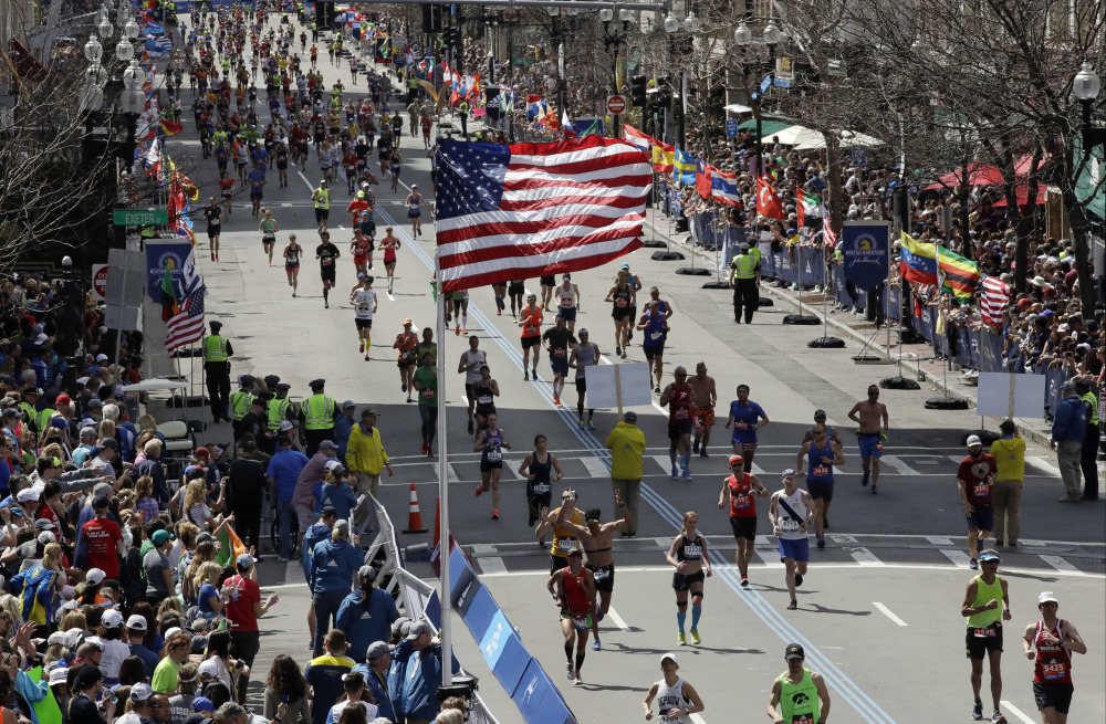 Runners head down the stretch to the finish line in the 121st Boston Marathon on Monday.