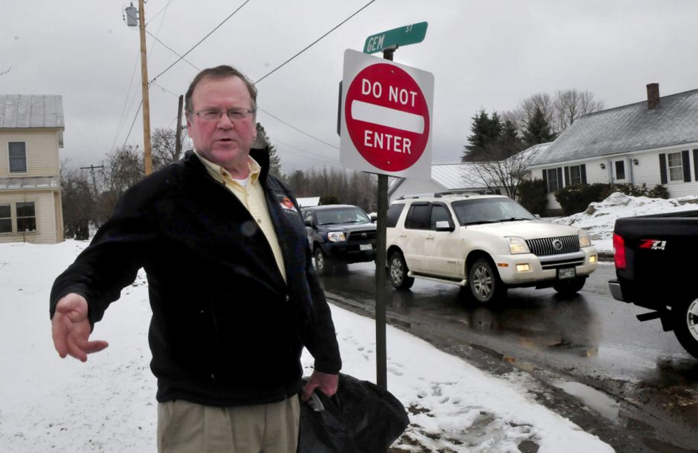 Skowhegan Road Commissioner Greg Dore stands earlier this month at the intersection of Gem Street and North Avenue in Skowhegan where Gem Street became a one-way road on Monday in hopes of relieving traffic congestion and slowing down traffic.