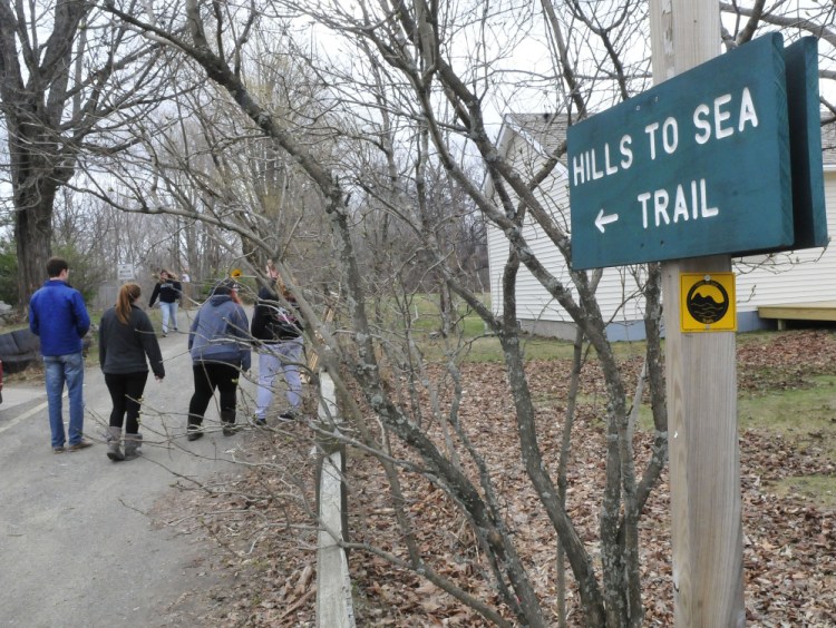 Walkers use the Hills-to-Sea Trail on Tuesday near the beginning of the 47-mile path from Unity to Belfast. The trail system's grand opening is scheduled for National trails Day, June 3.