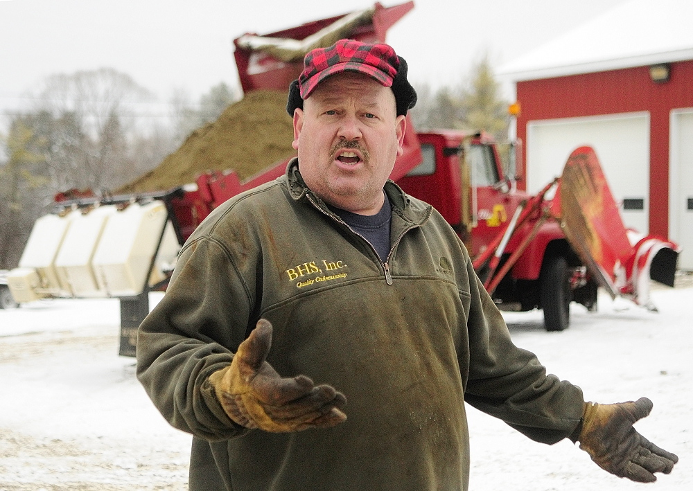 Chris Ellis talks about the calcium chloride dispensers on his plow trucks on December 10, 2013, at Ellis Construction in Farmingdale at a time when he was in a dispute with the town.