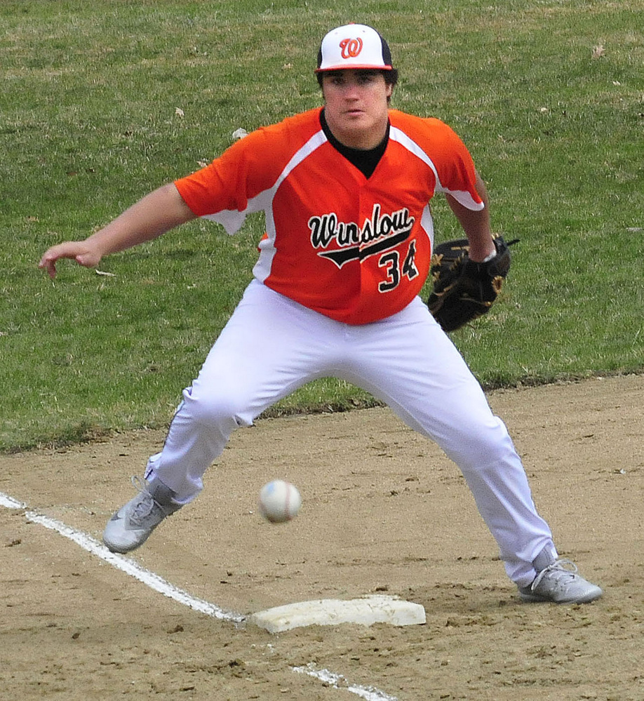Winslow's Alex Demers eyes a ball thrown to third base during a game Wednesday in Waterville.
