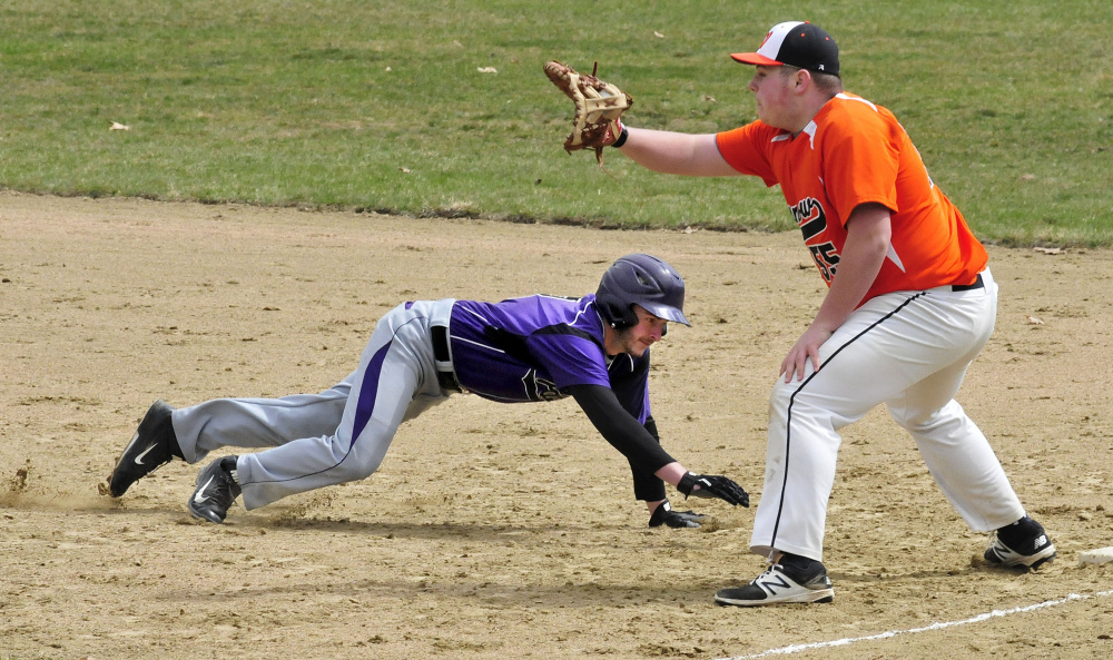 Winslow's Andrew Bolduc waits for the ball during a pick-off attempt on  Waterville's Cody Pellerin on Wednesday in Waterville.