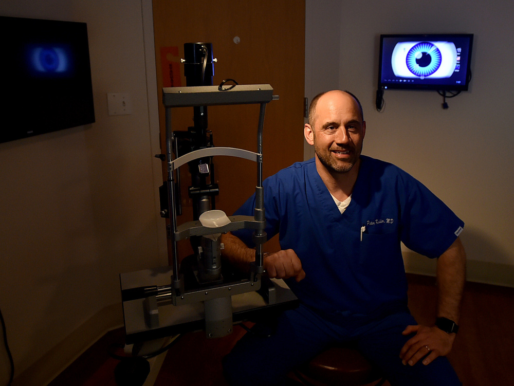 Dr. Peter Kohler poses April 11 in his examination room at Eye Care of Maine in Waterville. The practice has been named the 2016 Business of the Year by the Mid-Maine Chamber of Commerce.