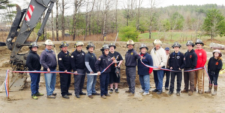 Pittston firefighters pose for a photo during a ceremonial groundbreaking for the new fire station Saturday in East Pittston.