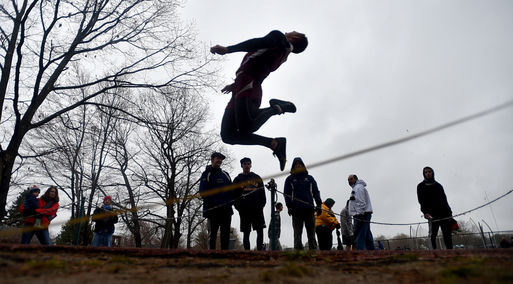 Maine Central Institute's Devon Varney jumps 16-11 in the long jump at the Waterville Relays on Saturday in Waterville.