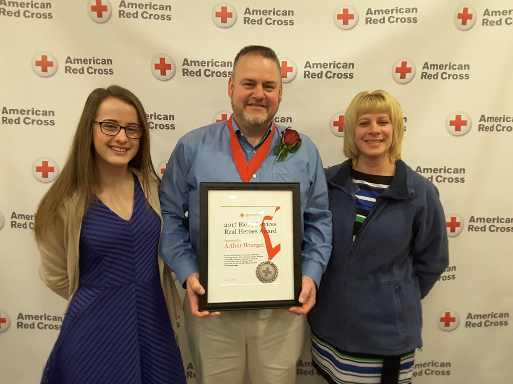 Arthur Bourget, of West Gardiner, center, was presented the American Red Cross 2017 Real Hero Blood Services Award. With him is his daughter, Emma, left, and his wife, Sandy, right.