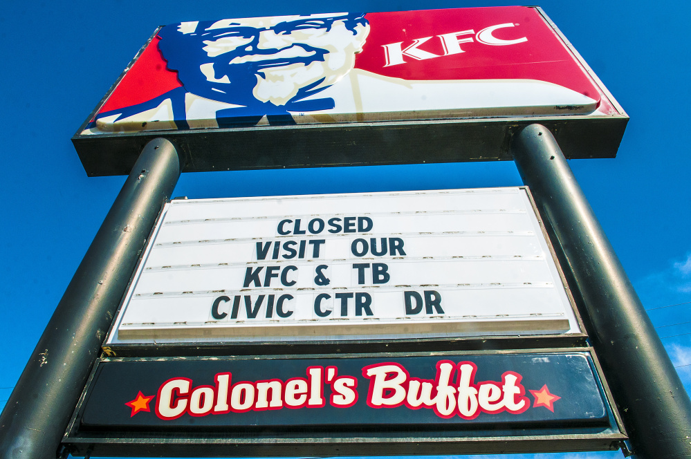 The sign at the KFC restaurant on Western Avenue in Augusta directs customers to the Civic Center Drive location after closing its doors Friday.