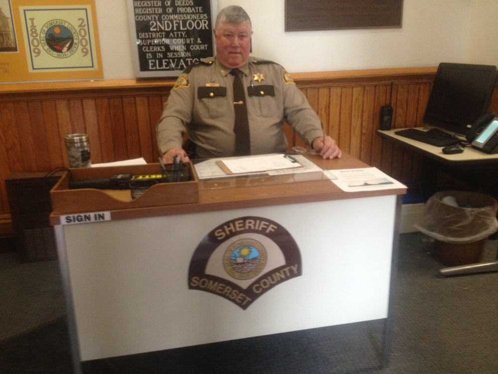 Somerset County sheriff's Deputy Mike Cray sits at his new work station as a security officer in the Somerset County Courthouse in Skowhegan. Cray, of Palmyra, started his new duties April 1. Somerset County Administrator Dawn DiBlasi said things were getting "more and more volatile" in courthouses across the state.