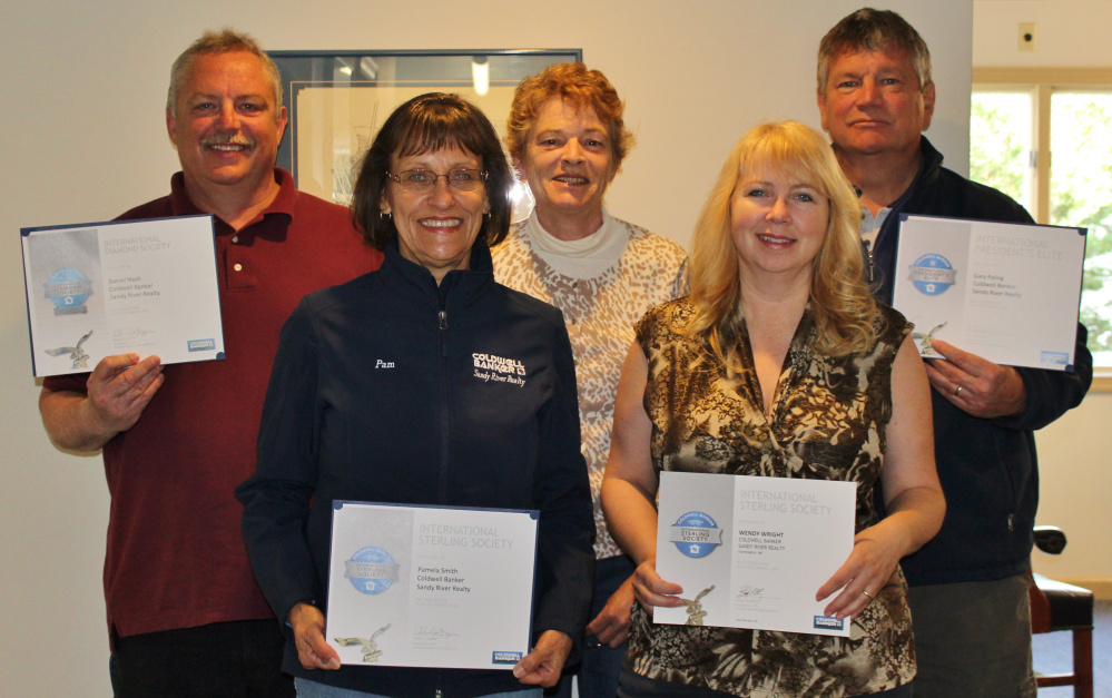 Sandy River Realty Coldwell Banker National's 2016 award winners are, in front from left, Pamela Smith and Wendy Wright; and at rear from left, Dan Nash, Juanita Bean Smith and Gary Paling.