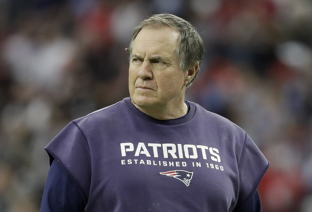 In this photo taken Feb. 5,  New England Patriots head coach Bill Belichick watches during warm ups before Super Bowl 51 football game against the Atlanta Falcons in Houston.