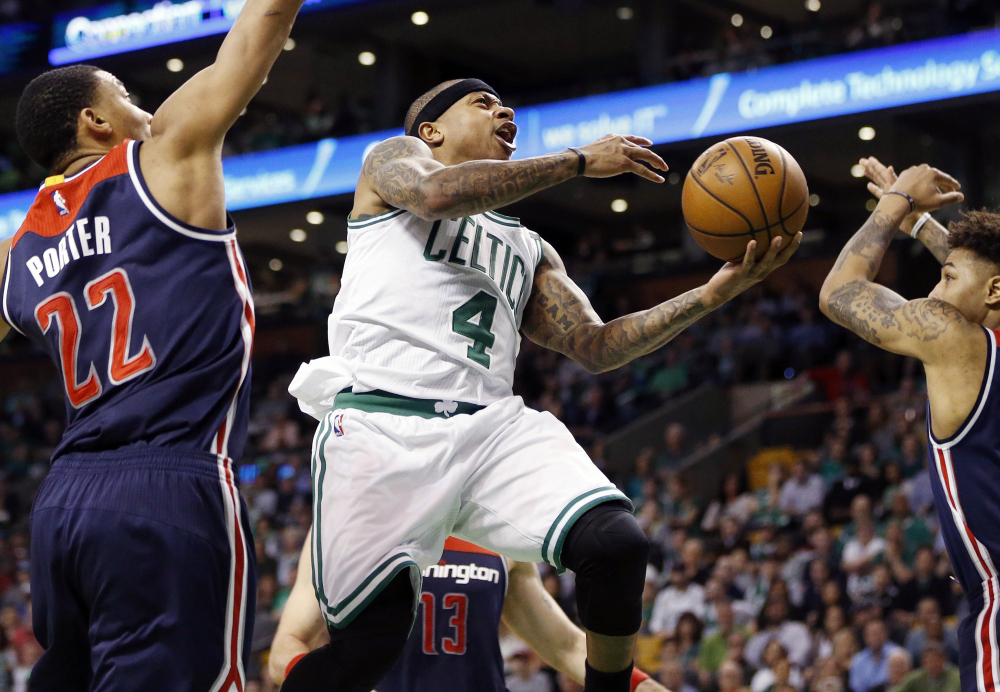 Celtics' Isaiah Thomas goes up to shoot against Washington Wizards' Otto Porter Jr. during the second quarter of a second-round NBA playoff series game Sunday in Boston.