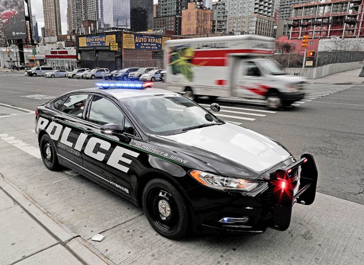A prototype of the Ford Fusion Responder hybrid sits along 11th Avenue in New York. 
