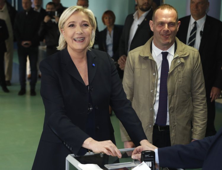 Far-right leader and candidate for the 2017 French presidential election Marine Le Pen casts her vote in the first-round presidential election in Henin-Beaumont, France, on Sunday.