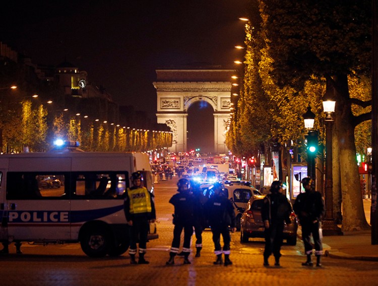 Police seal off the Champs Elysees avenue in Paris after the attack on Thursday.