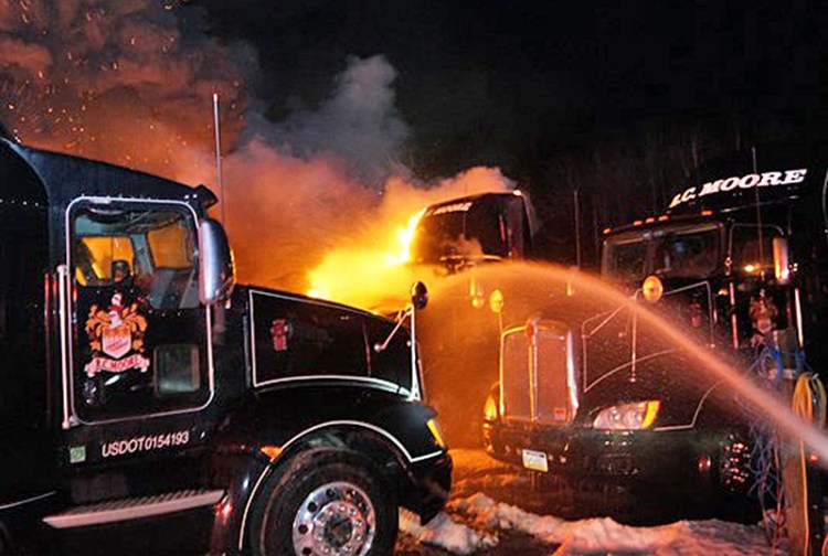 Trucks burning Sunday night at the R.C. Moore depot on Spring Water Road in Poland.