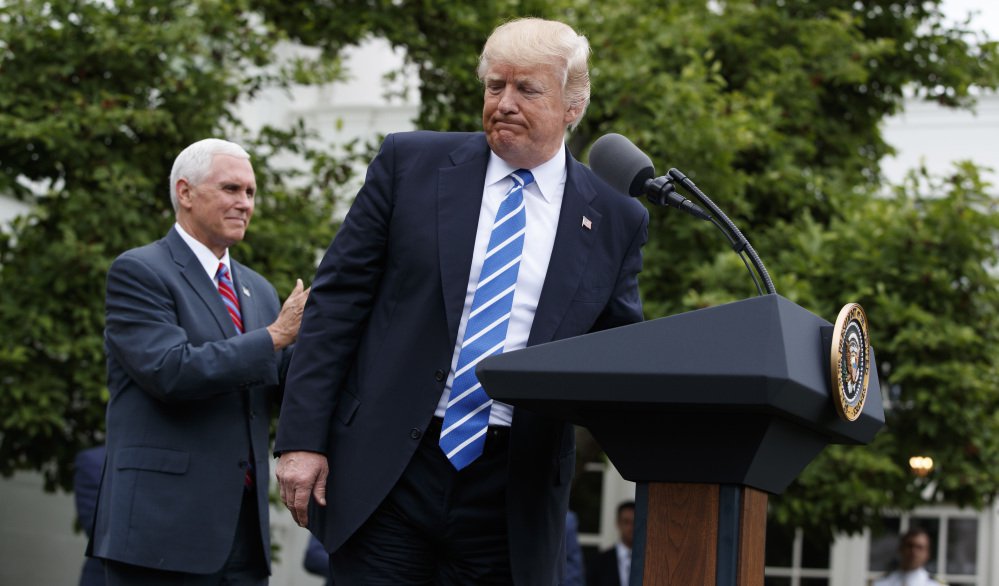 Vice President Mike Pence applauds as President Donald Trump walks off after speaking to the Independent Community Bankers Association, Monday, May 1, 2017, in the Kennedy Garden of the White House in Washington. (AP)