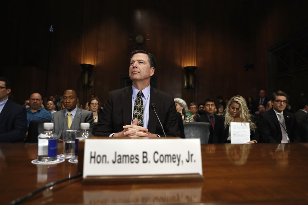 FBI Director James Comey prepares to testify on Capitol Hill in Washington on Wednesday before a Senate Judiciary Committee hearing. "If I did something wrong, I want to hear that," he said.