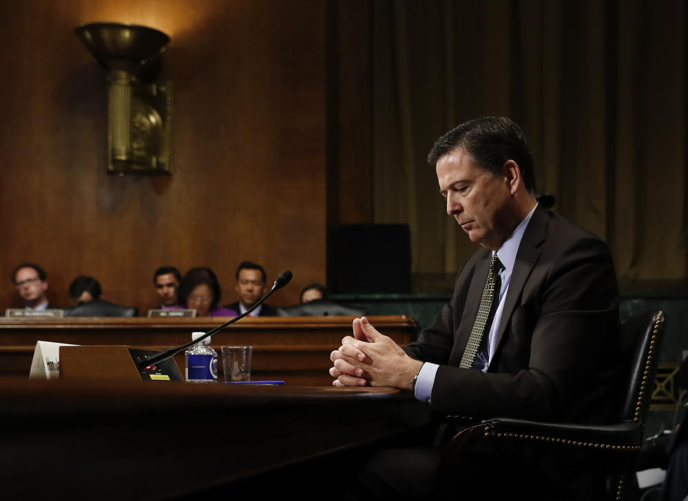 James Comey pauses as he testifies May 3 before the Senate Judiciary Committee. President Trump abruptly fired Comey last week, ousting the nation's top law enforcement official in the midst of an investigation into whether Trump's campaign had ties to Russia's election meddling.