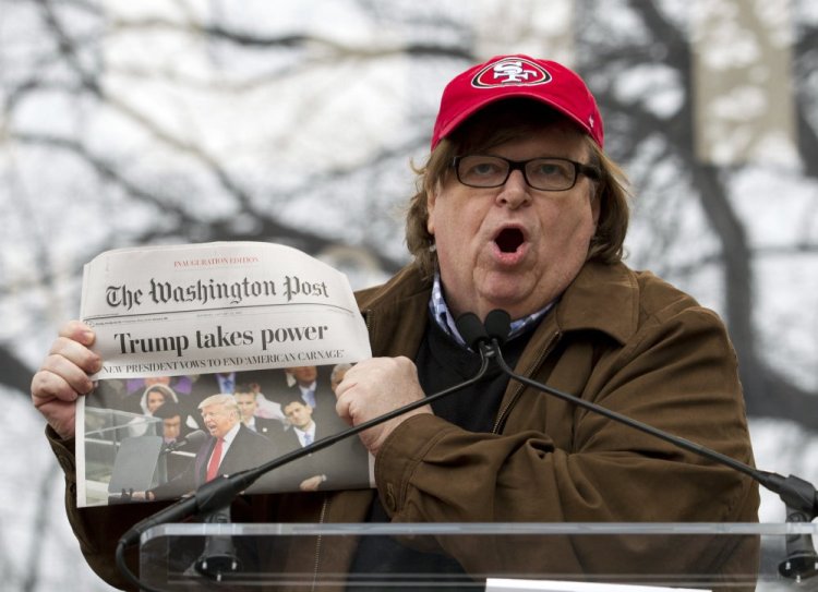 Film director Michael Moore speaks during the Women's March rally Jan. 21 in Washington. He says his upcoming documentary about President Trump will be explosive.