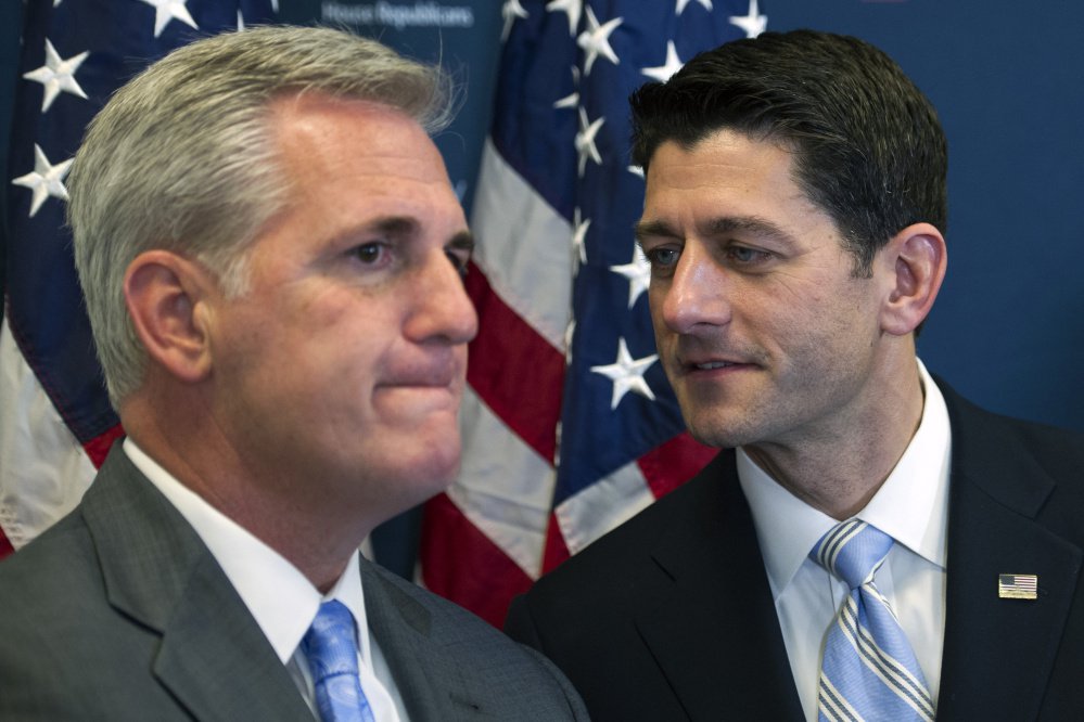 House Speaker Paul Ryan of Wisconsin, right, speaks with House Majority Leader Kevin McCarthy of California in November 2016. In a June 15, 2016, conversation, McCarthy makes an apparent joke about the Russian president paying then-candidate Donald Trump.
