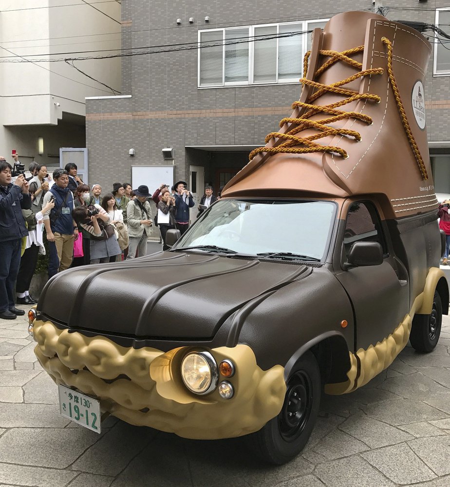 In this April 26, 2017 photo provided by L.L. Bean, the company's Bootmobile is displayed in Tokyo, Japan. The Maine-based outdoors company already has two of the rolling Bean boots in the U.S. Now this third version will be visiting Bean's stores in Japan.