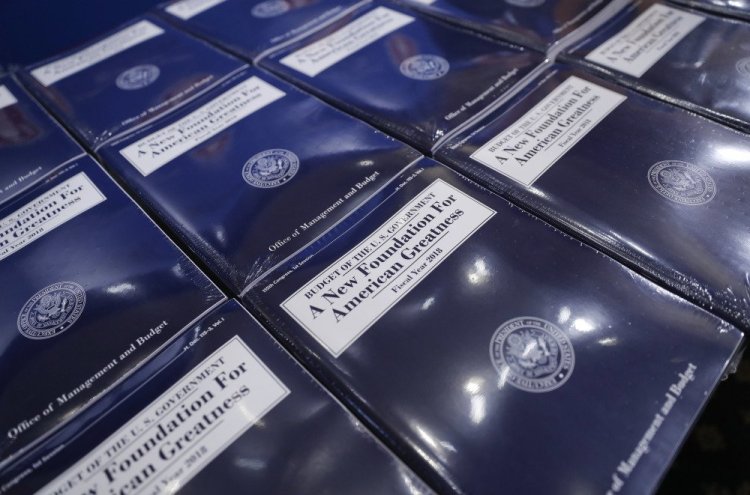 Copies of President Trump's fiscal 2018 federal budget are laid out ready for distribution on Capitol Hill in Washington.