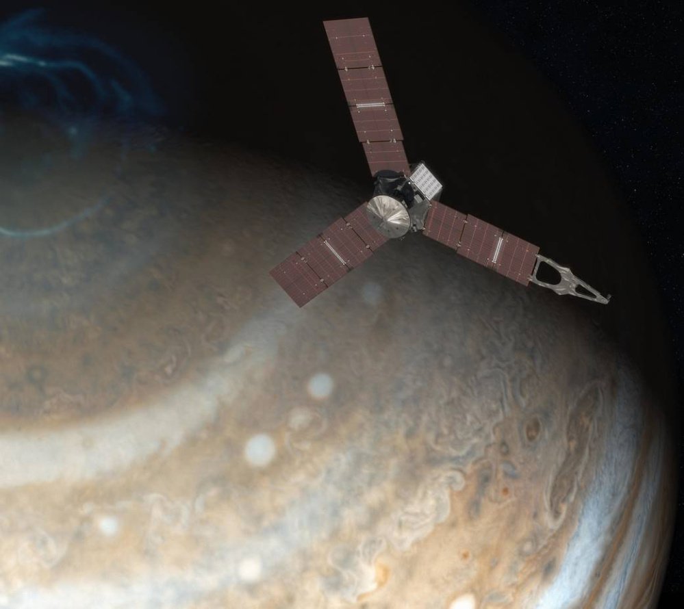 An artist's rendering, left, depicts NASA's Juno spacecraft above Jupiter's north pole.
Above, this image made available by NASA on Thursday from data captured by the Juno spacecraft shows Jupiter's south pole. The oval features are cyclones, up to 600 miles in diameter.
NASA via Reuters/Associated Press