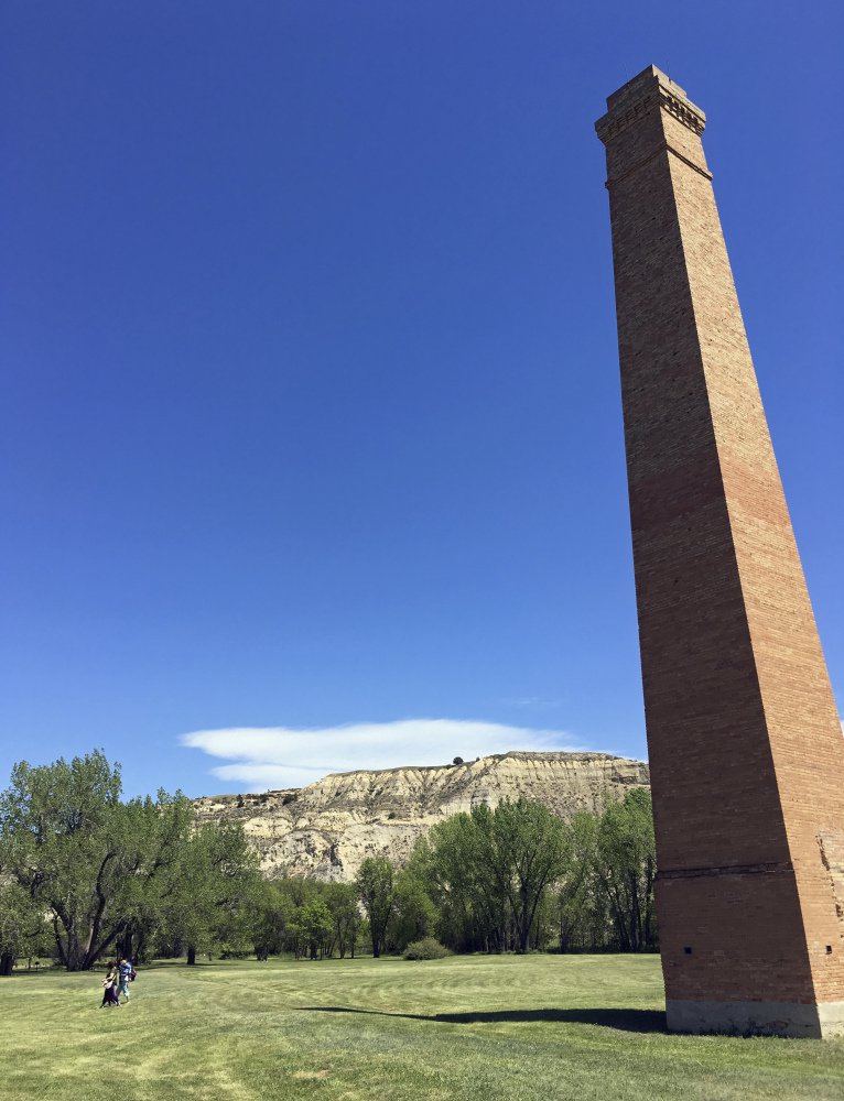 A smokestack from an Old West-era meatpacking plant is shown in Theodore Roosevelt National Park in western North Dakota, where Meridian Energy Group has set off alarms by proposing to build what it describes as "the cleanest refinery on the planet."
