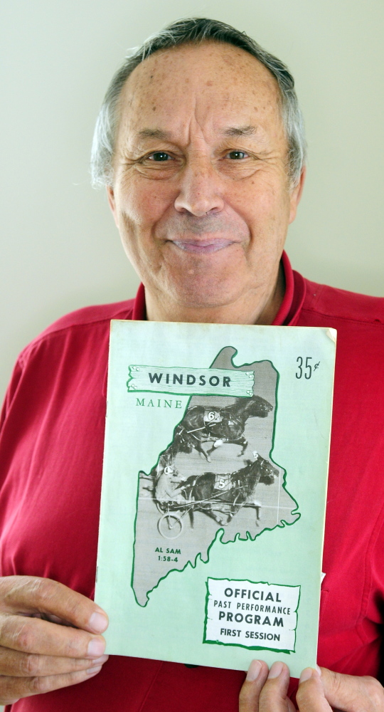 Eino Leinonen holds up a 1967 Windsor Fair racing program in 2015 at his Nobleboro home. Leinonen's grandson, Derek Rivers, was selected by the New England Patriots in the third round of the NFL draft.