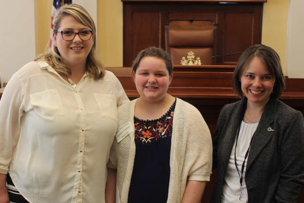 Maranacook Community Middle School student London Putnam served as an honorary page April 11 in the Maine Senate. From left are Katie Putnam, London and Bellows.