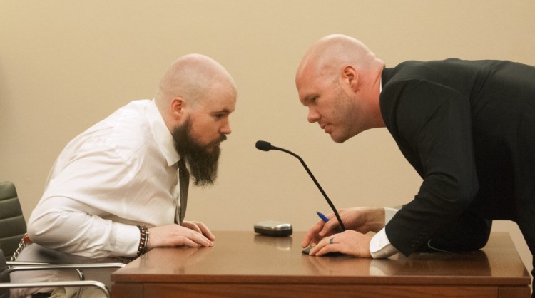 Leroy Smith III, left, confers with defense attorney Scott Hess Jan. 20 at Capital Judicial Center in Augusta during a hearing on Smith's mental competence to tried for murder, in connection with the slaying and dismembering of his father in May 2014.