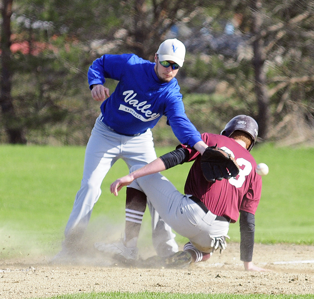 Valley third baseman Donovan Beane looses the ball as Richmond's Dan Stewart slides into third during a game Thursday in Richmond. Stewart went onto score on the play.