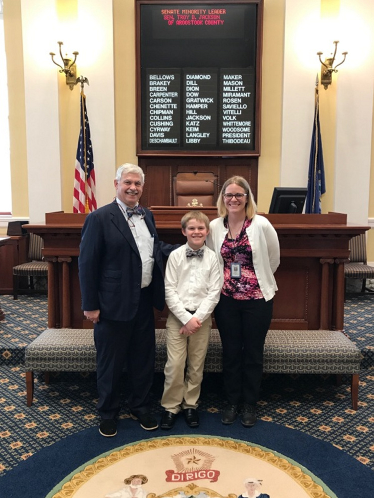 For Take Our Daughters and Sons to Work Day on April 27, Marietta Wheeler, of Belgrade, brought her son, Jayme, to Augusta to join her for the day at the Department of Administrative and Financial Services Sen. From left are Rep. Tom Saviello, R-Wilton, Jayme and Marietta Wheeler.