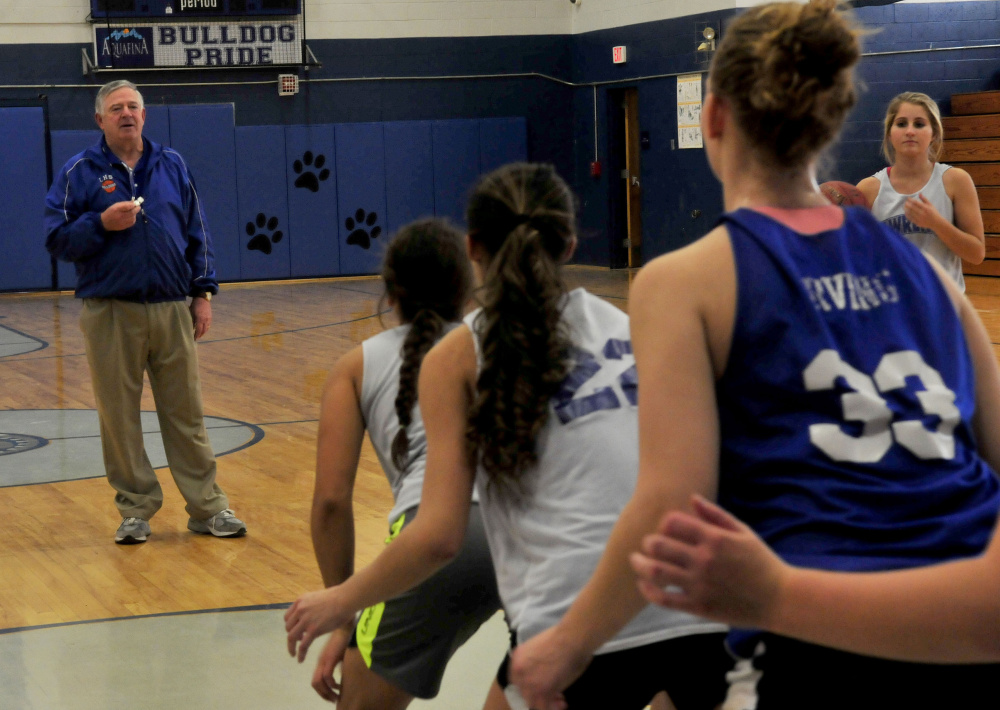 Lawrence head coach John Donato leads players duringa 2015 practice in Fairfield.