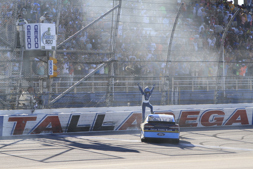 Ricky Stenhouse Jr. (17) celebrates at the start finish line after winning the Camping World 500 on Sunday at Talladega Superspeedway.