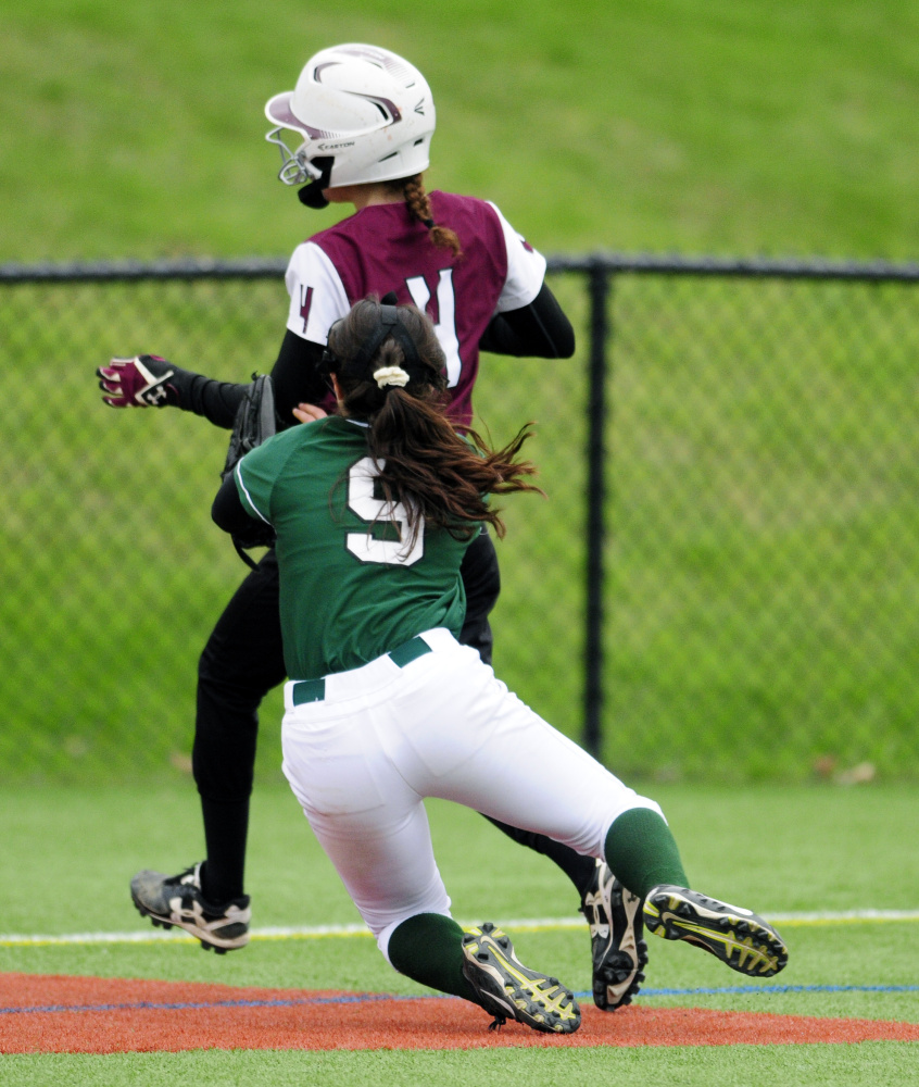 Winthrop third basemen Amber Raymond (9) tags out Monmouth Academy baserunner Emily Kaplan to end the fourth inning during a game Tuesday at Kents Hill School.