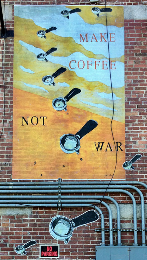 Make Coffee Not War is one of eight public art pieces installed ahead of the first Gardiner Artwalk of the season. Each year for the past decade artists at Artdogs Studios, an artists collective in Gardiner, have created a body of work based on the variation of a theme. This year, the artists are using buildings in downtown Gardiner as the canvas for their work.