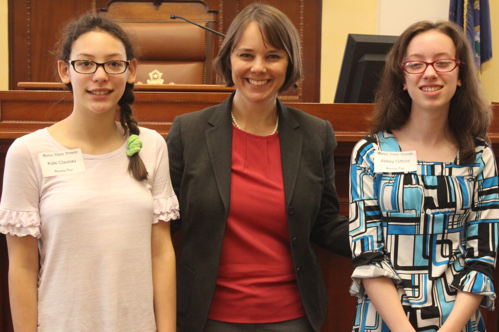 Hall-Dale Middle School students Kate Claveau, left, and Abbey Gifford, right, served as an honorary pages April 27 in the Maine Senate in Augusta. They were guests of Sen. Shenna Bellows, D-Manchester.