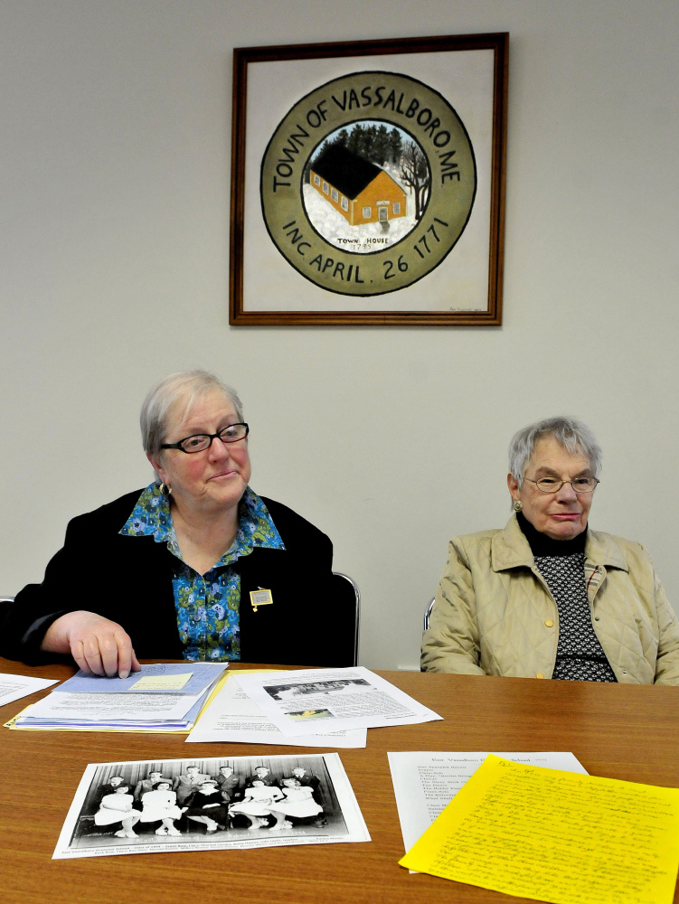 Vicki Schad, left, and Ester Bernhardt, members of the Vassalboro Historical Society, discuss progress on Thursday on "The Vassalboro Anthology of Tales," a compilation of stories about the town and residents.