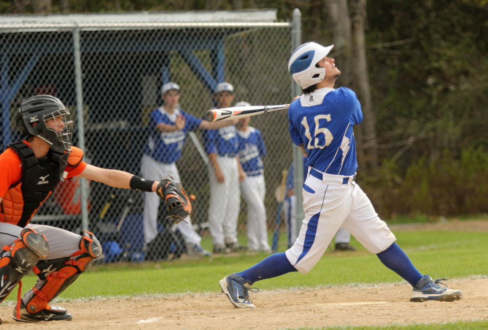 Photo by Jeff Pouland 
 Erskine Academy's Nick Turcotte pops up a pitch from Gardiner Area High School's Sam Jermyn on Saturday in South China.
