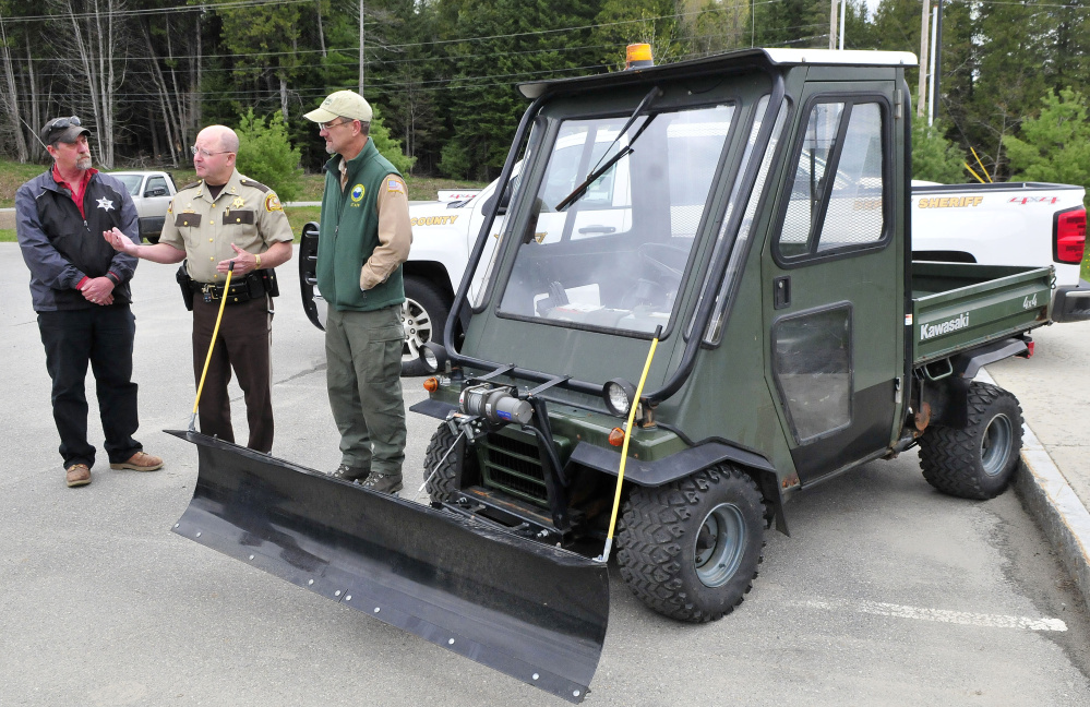 Somerset County Sheriff Dale Lancaster, center, speaks about the donation of the all terrain vehicle to Lake George Regional Park on Tuesday. At left is Sheriff Office Work Crew Supervisor Dave Davis and at right is park ranger Derek Ellis.