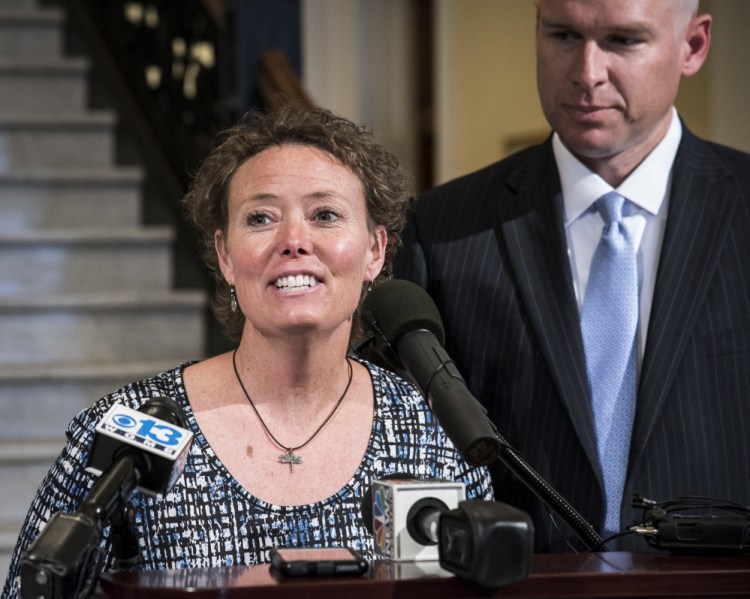 Toni Richardson, center, an education technician in the Augusta School Department addresses media at a press conference in the State House Hall of Flags on Tuesday. She is joined by her attorney Jeremy Dys of First Liberty Institute, a legal organization the specializes in defending religious freedom.