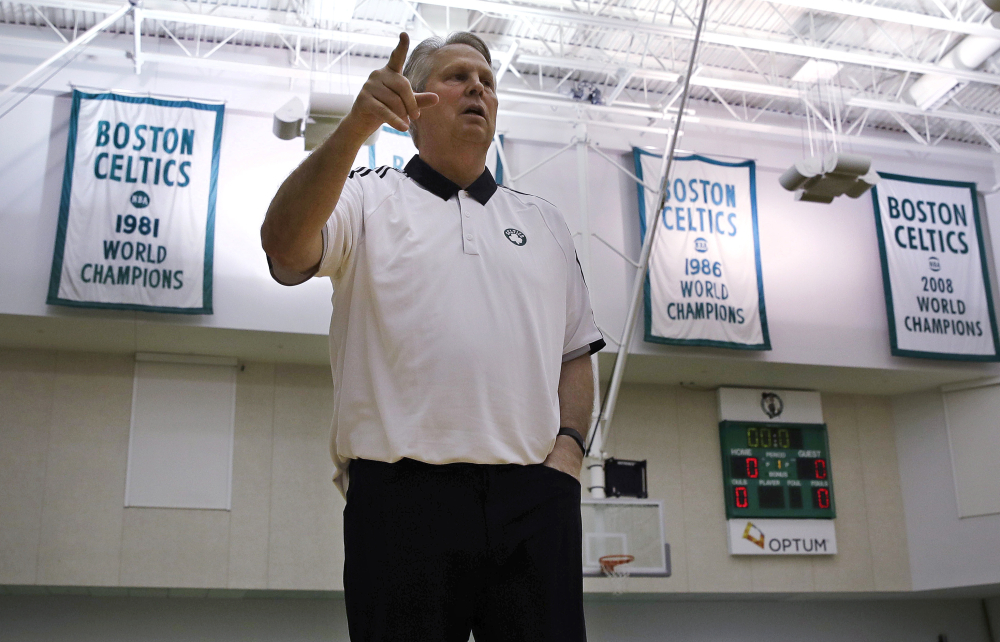 Danny Ainge, Boston Celtics president of basketball operations, gestures as he passes the team's NBA championship banners st the team's training facility in Waltham, Massachusetts on Tuesday. The Celtics had won the NBA draft lottery, capitalizing on a trade they made with the Brooklyn Nets four years ago.
