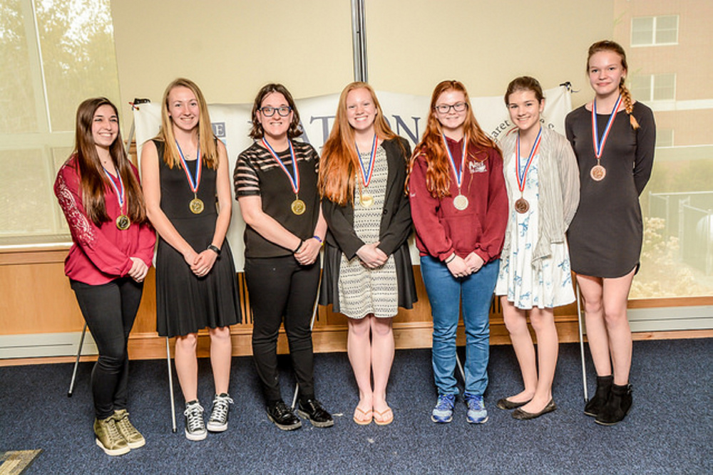 Maine National History Day winners in the Senior Group Exhibit category, from left, are Samantha Wilson, Harley Dixon, Allison Turlo and Sierra Weston, all from Lawrence High School, placed first; Kailee Sprague and Alyviah Paquette (not pictured), both from Noble High School, placed second; and Madison Momenee and Anna Richardson, both from Noble High School, placed third.