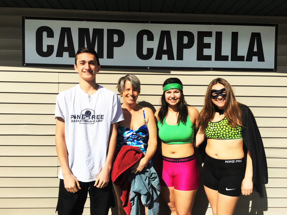 Three Hall-Dale High School students and their faculty advisor recently took part in the school's Key Club Polar Plunge for Camp Capella. From left are Anthony Romano, Advisor Lydia Leimbach, Kaylee Bickford and Sierra Millay.